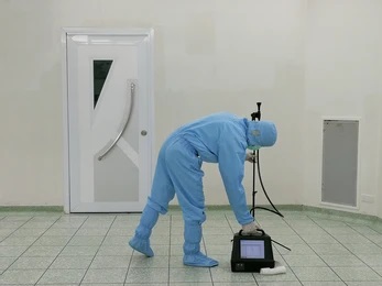 Attic Cleanup technician using air scrubbing machine