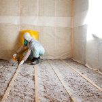 Master stacked cellulose insulation in the floor Worker installing cellulose insualtion