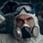A man with PPE including respirator
