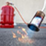 a propane torch used for burning a raccoon latrine