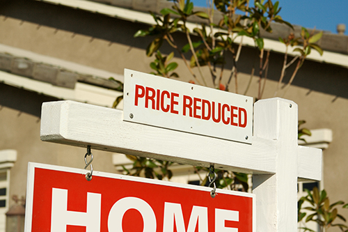 Price reduced real estate sign