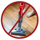 Image of vacuum cleaner with red cross over it