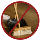 image of sweeping brush with red cross